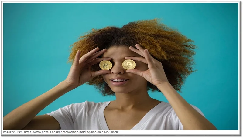What are Cryptocurrency Scams & how to avoid these Crypto Scams? 1 woman holding Bitcoin